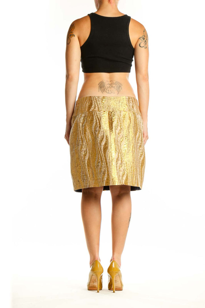 Gold metallic mini skirt with front zip closure by BCBG MaxAzria, back view