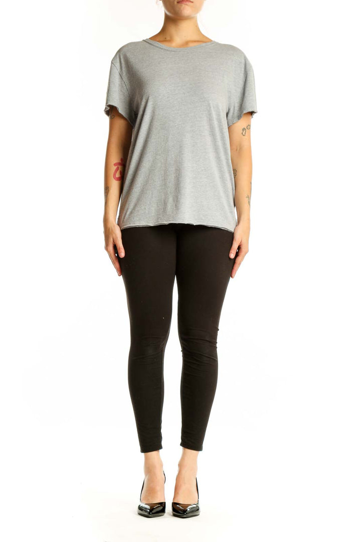 Gray organic cotton short sleeve crew neck tee by WE THE FREE, front view on model
