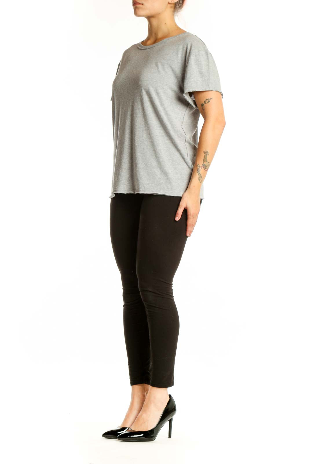 Gray organic cotton short sleeve crew neck tee by WE THE FREE, front view on model