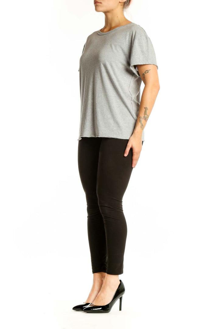 Gray organic cotton short sleeve crew neck tee by WE THE FREE, front view on model