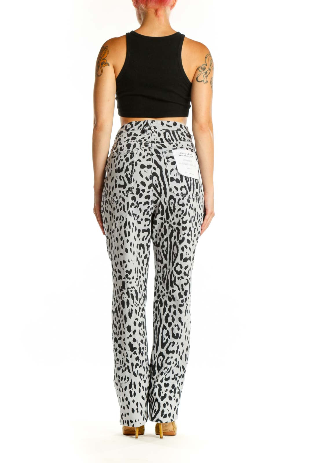 Back view of white and black leopard print denim jeans by Good American, size XXL, showing flattering high-waisted silhouette