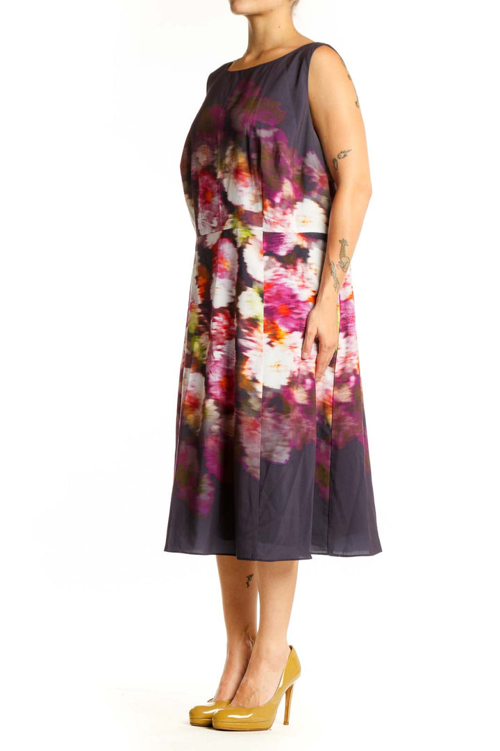 Navy floral A-line midi dress with pink and magenta watercolor blooms, sleeveless crew neckline, front view