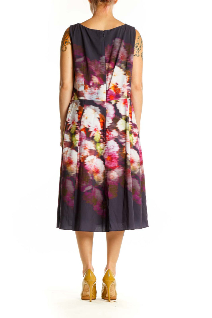 Navy floral A-line midi dress back view showing elegant drape and vibrant floral pattern