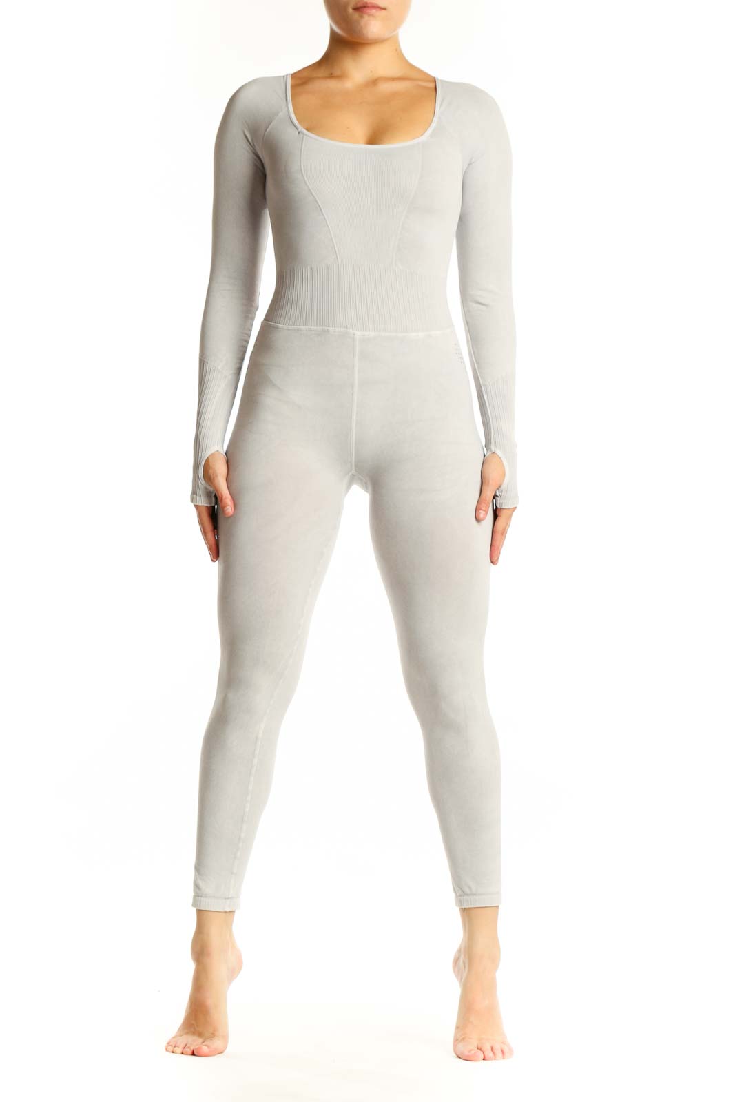 Front view of cream ribbed long sleeve all-in-one jumpsuit with scoop neckline and high-waisted design