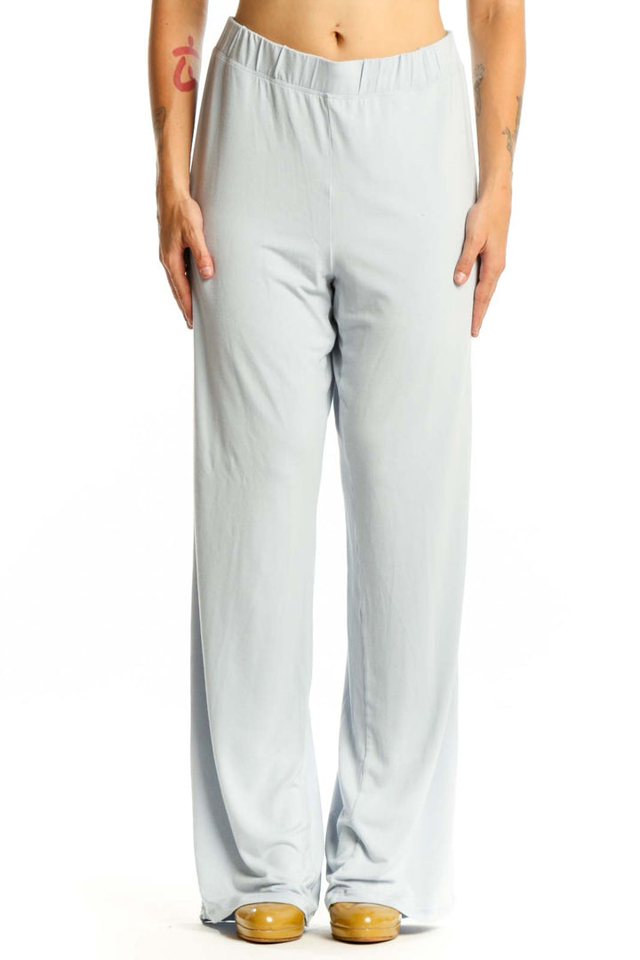 Gray wide leg pants with elastic waistband, front view on model wearing black crop top