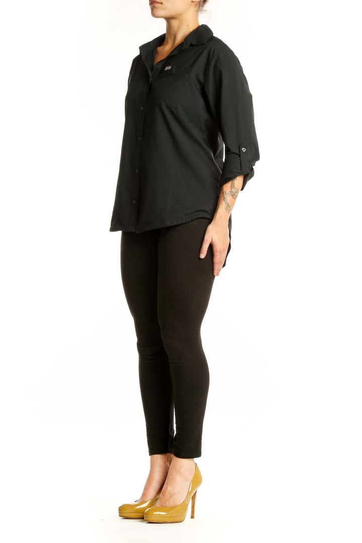 Black button-up collared shirt with rolled sleeves and chest pocket, front view