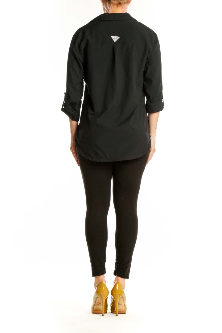 Black button-up collared shirt back view showing relaxed fit and collar detail