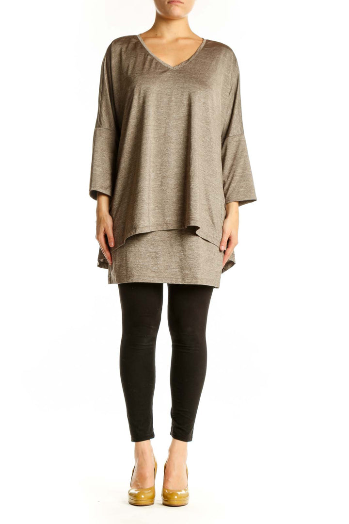 Taupe layered v-neck tunic top with three-quarter sleeves and asymmetrical hemline, front view