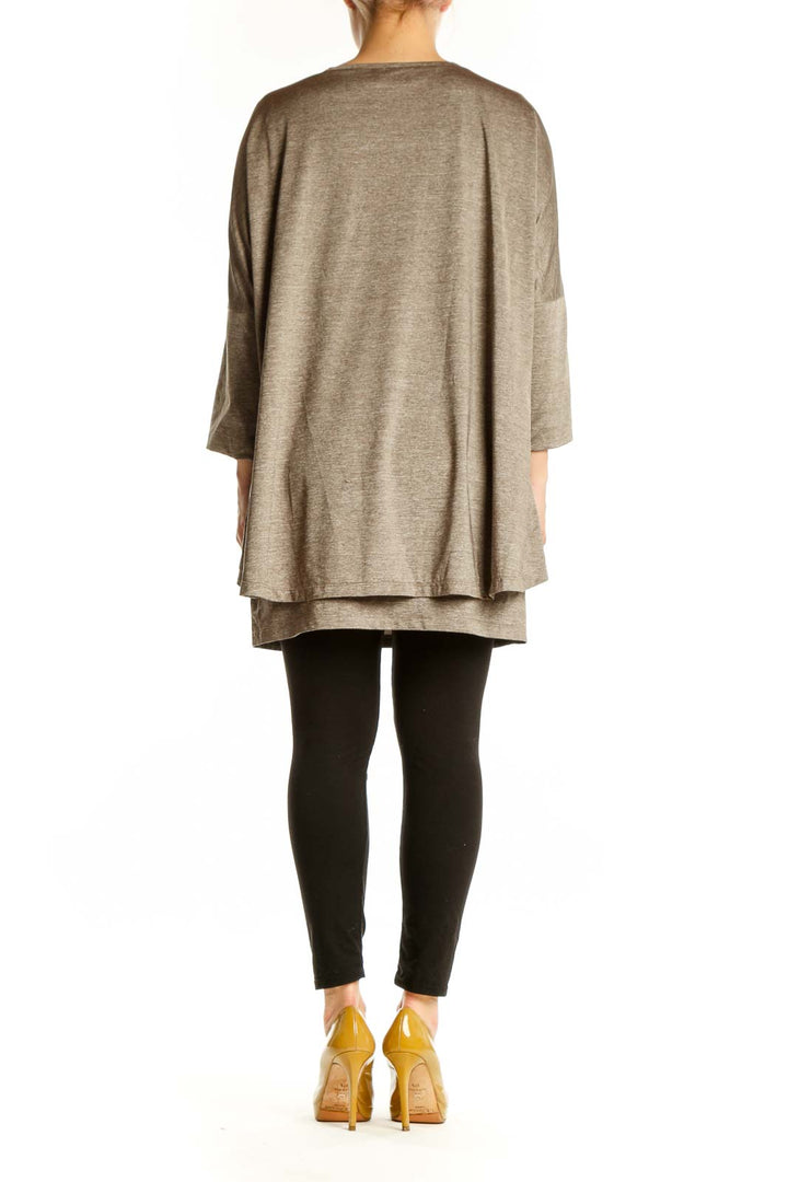 Taupe layered v-neck tunic top with three-quarter sleeves and asymmetrical hemline, back view