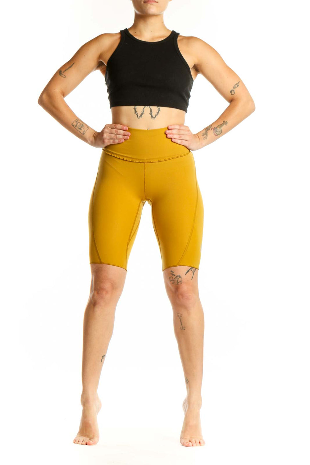 Yellow high-waist bike shorts front view showing form-fitting silhouette and premium fabric quality