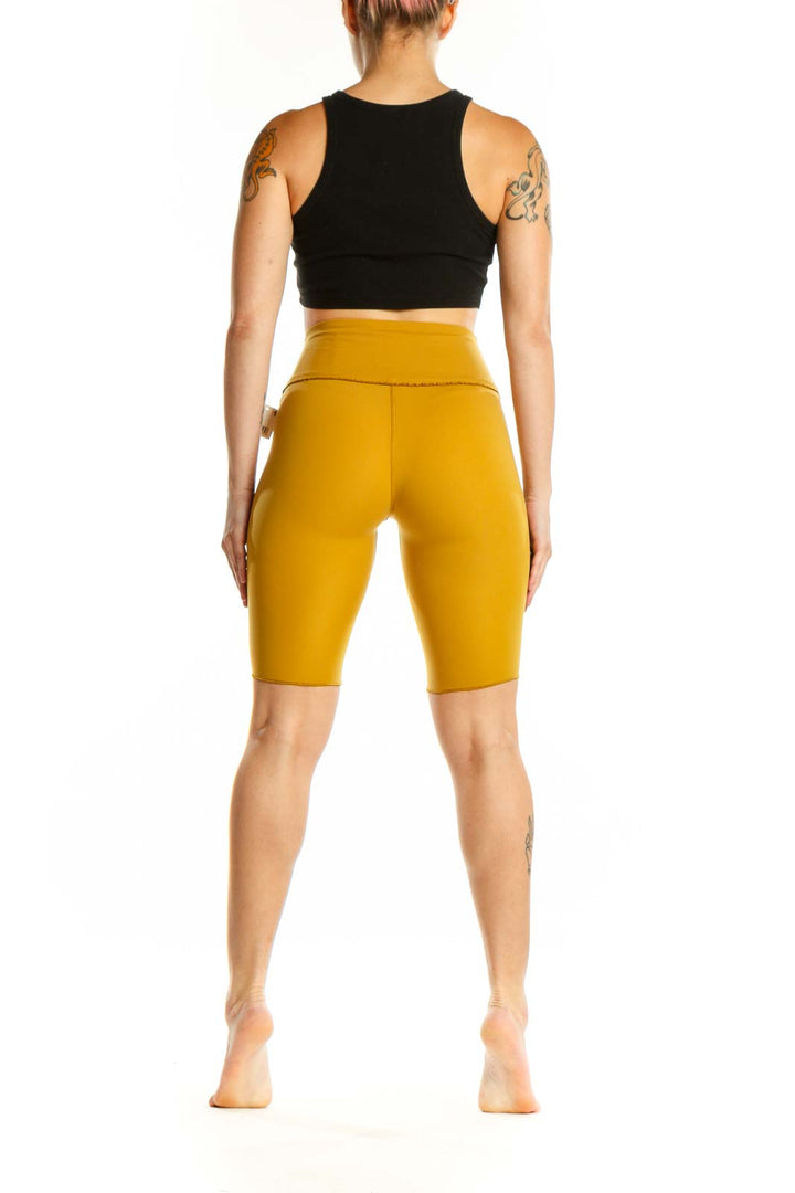 Yellow high-waist bike shorts back view displaying sleek design and comfortable fit