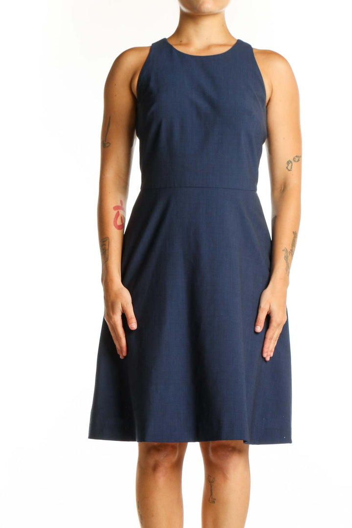 Navy sleeveless A-line dress with crew neckline, front view on model