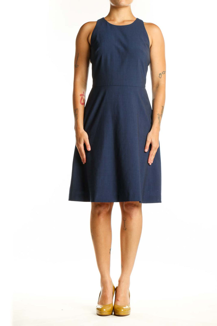 Navy sleeveless A-line dress with crew neckline, front view on model
