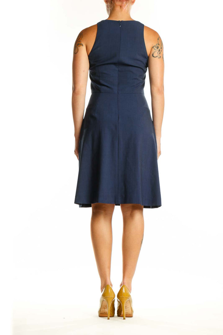 Navy sleeveless A-line dress with crew neckline, back view on model