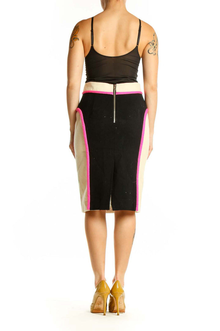 Black pencil skirt with neon pink and cream vertical colorblock stripes, back view