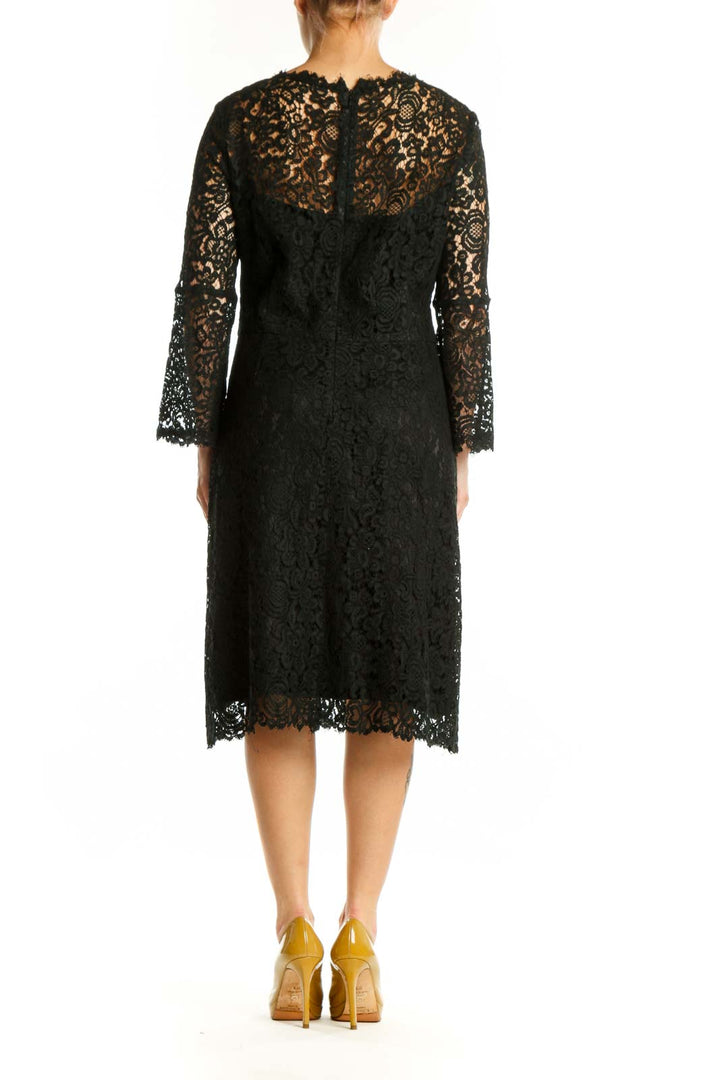 Black lace long sleeve midi dress with A-line silhouette and lace detailing, back view