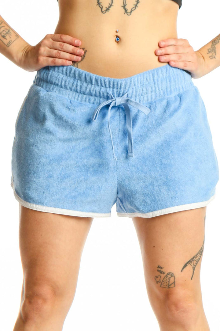 Light blue denim athletic shorts with drawstring waist and white contrast trim, front view