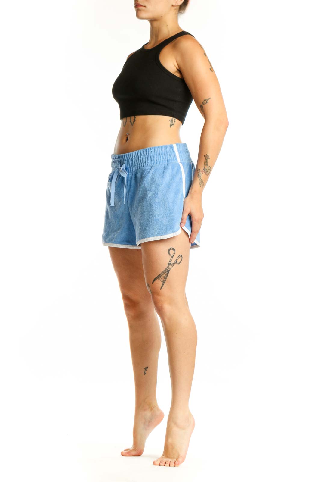 Light blue denim athletic shorts with drawstring waist and white contrast trim, front view