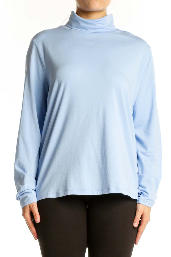 Light blue turtleneck long sleeve top from Lands' End, front view on model wearing black pants