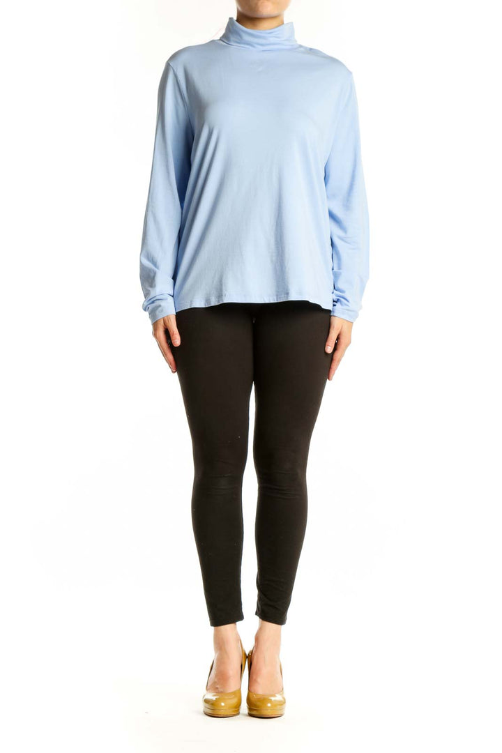 Light blue turtleneck long sleeve top from Lands' End, front view on model wearing black pants