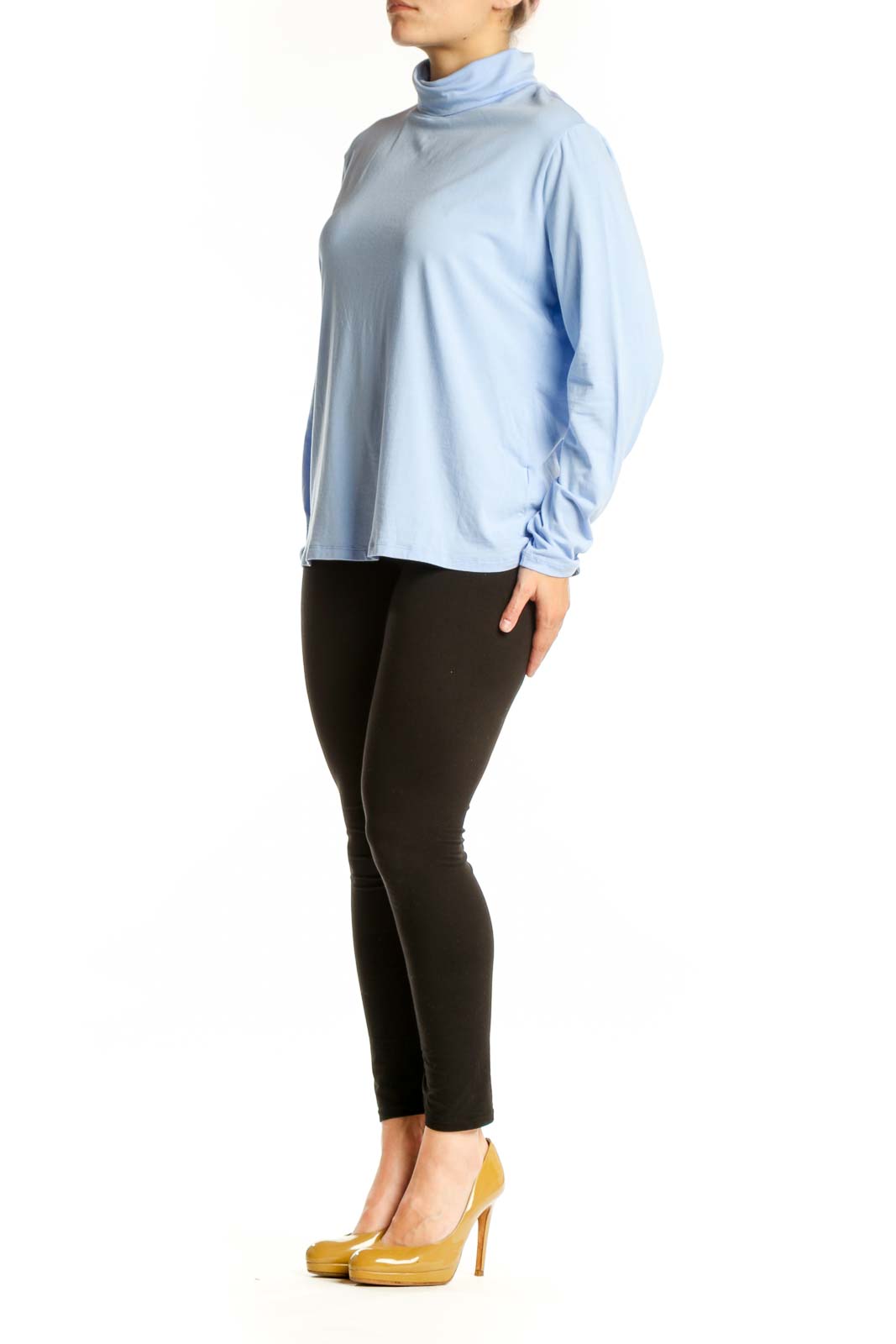 Light blue turtleneck long sleeve top from Lands' End, front view on model wearing black pants