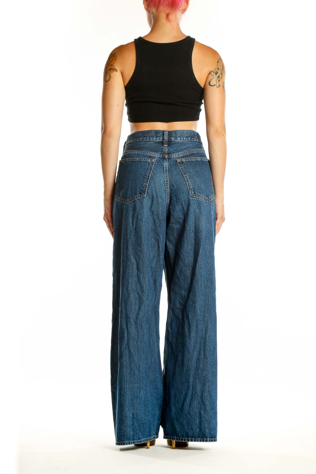 Back view of blue wide-leg denim jeans showing relaxed fit and classic denim construction