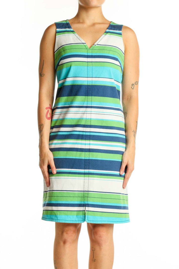 Front view of multicolor striped cotton dress with V-neckline and sleeveless design in navy, green, turquoise, and white stripes