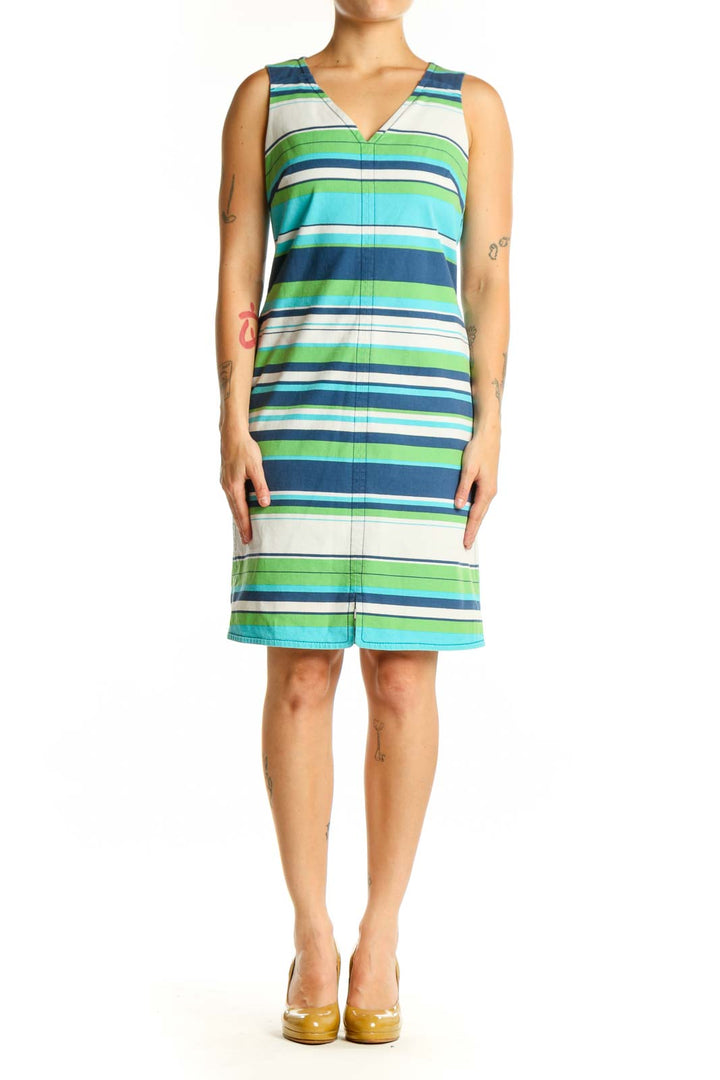 Front view of multicolor striped cotton dress with V-neckline and sleeveless design in navy, green, turquoise, and white stripes