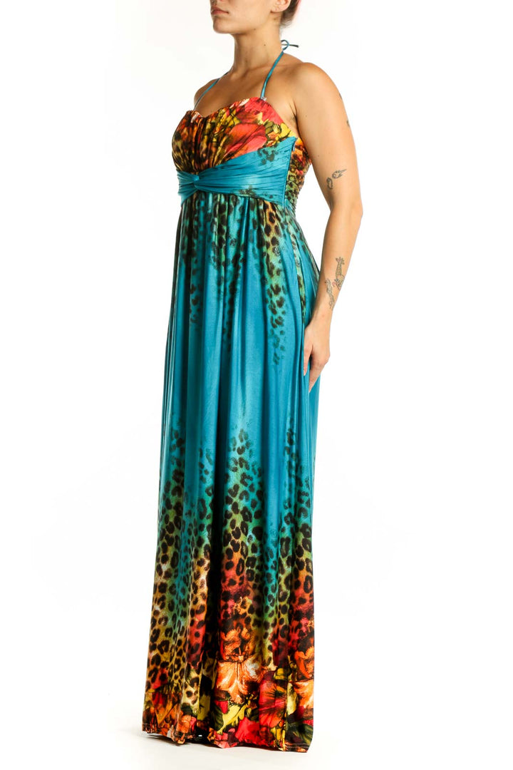 Front view of teal halter maxi dress with floral and leopard print by Joseph Ribkoff
