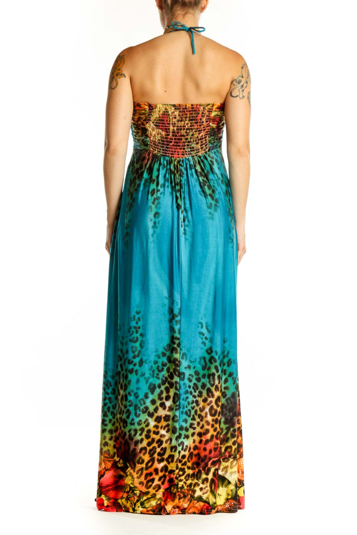 Back view of teal halter maxi dress with vibrant color-block floral design by Joseph Ribkoff