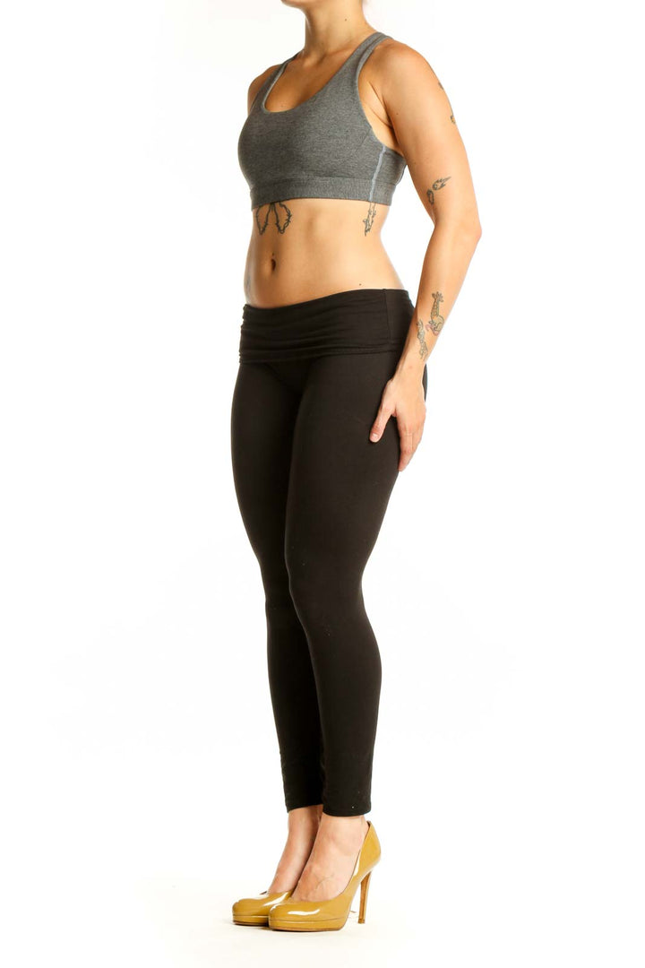 Gray Athleta Racerback Sports Bra with scoop neckline, front view on model