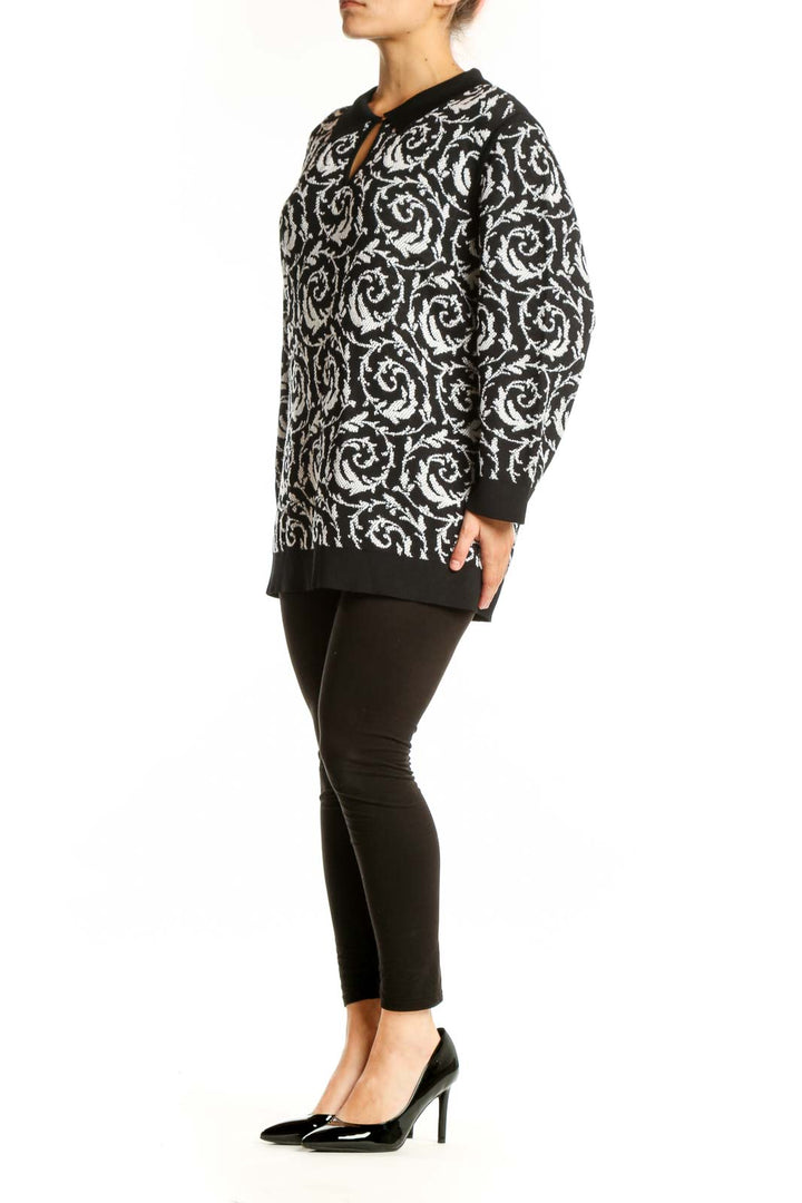 Black and white baroque patterned Karl Lagerfeld Paris pullover top with keyhole neckline and ribbed trim, front view