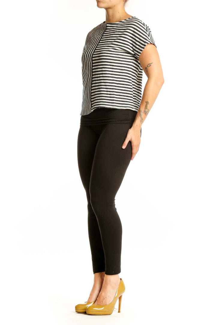 Navy and white striped short sleeve top with mixed vertical and horizontal stripe pattern, front view