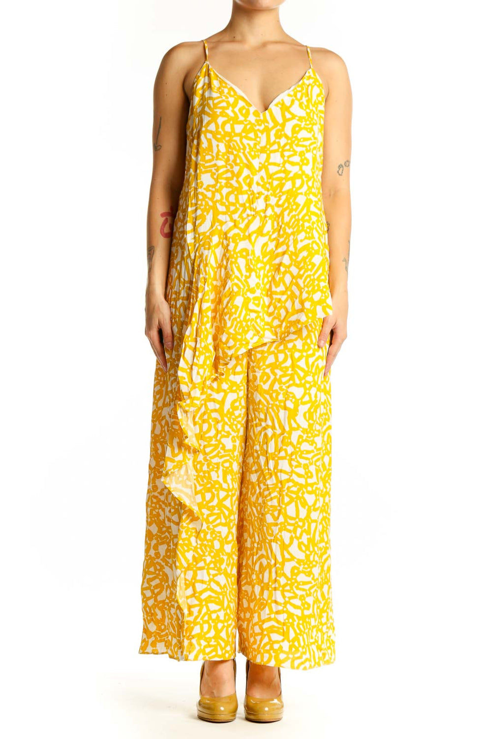 Front view of yellow abstract print Maeve all-in-one jumpsuit with V-neckline and spaghetti straps