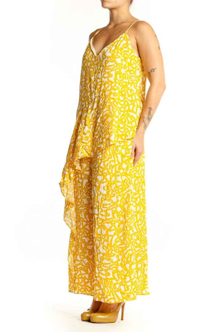 Front view of yellow abstract print Maeve all-in-one jumpsuit with V-neckline and spaghetti straps