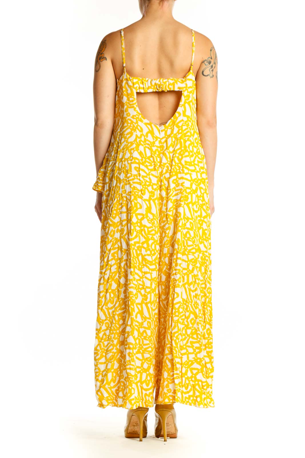 Back view of yellow abstract print Maeve all-in-one jumpsuit showing flowing wide-leg design