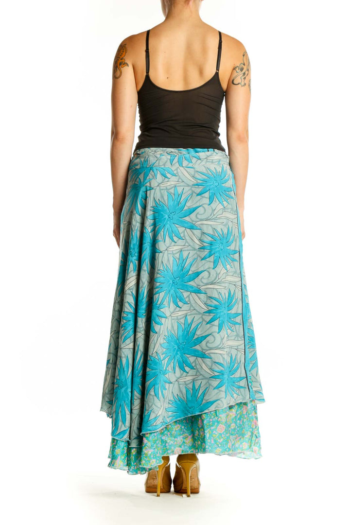 Turquoise floral wrap maxi skirt with layered floral pattern, back view showing flowing silhouette