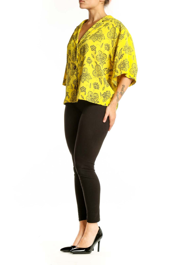 Yellow floral button-up blouse with botanical print and V-neckline, front view