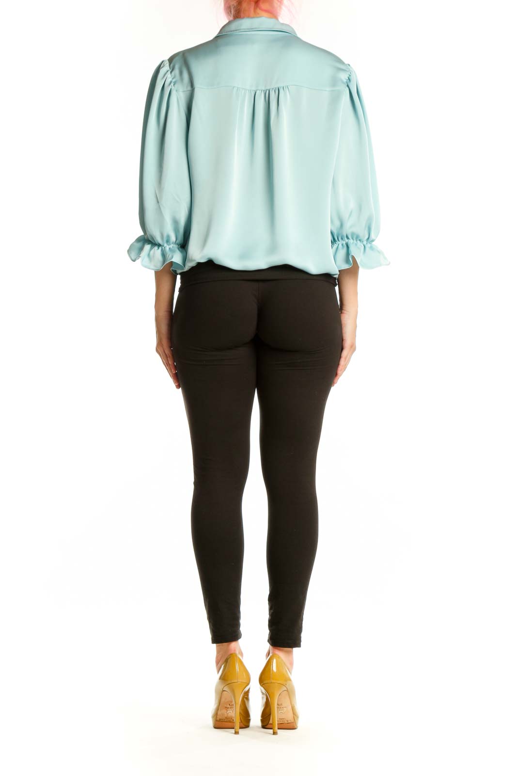 Back view of blue puff sleeve blouse showing relaxed fit and voluminous sleeve design