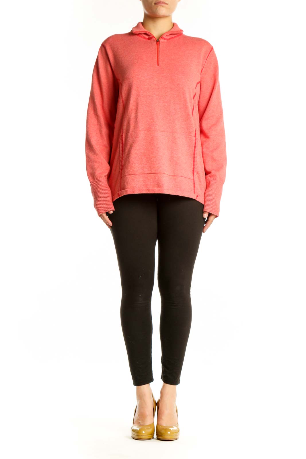 Woman wearing coral Eddie Bauer zip hoodie with quarter-zip design and hood, paired with black leggings