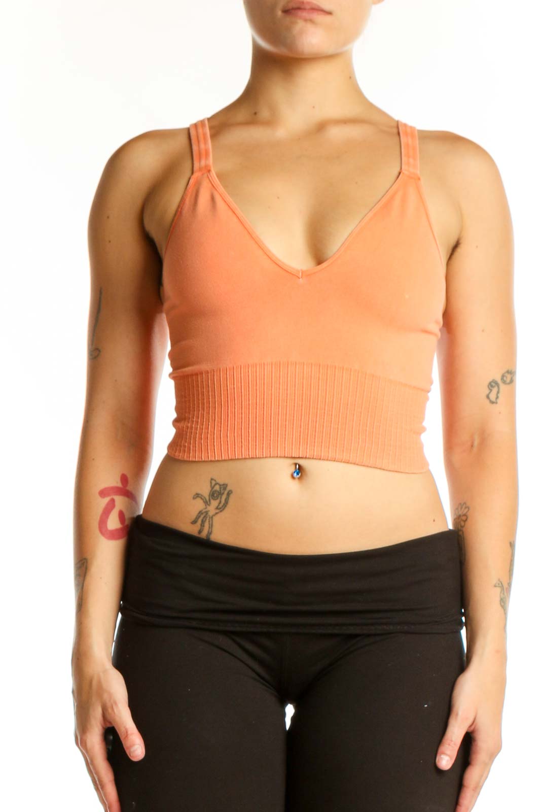 Peach ribbed crop tank top with V-neckline and ribbed midsection detail, front view