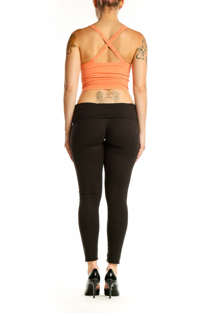 Peach ribbed crop tank top back view showing sleek design and fit