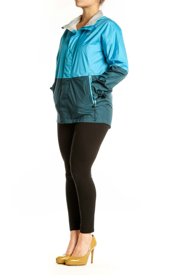 Blue and teal colorblock nylon windbreaker jacket front view with full-zip closure and gray collar lining