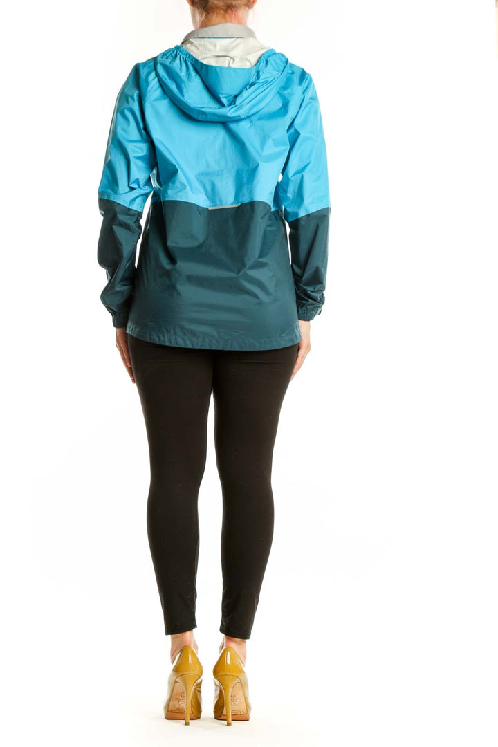 Blue and teal colorblock nylon windbreaker jacket back view showing colorblock design and relaxed fit
