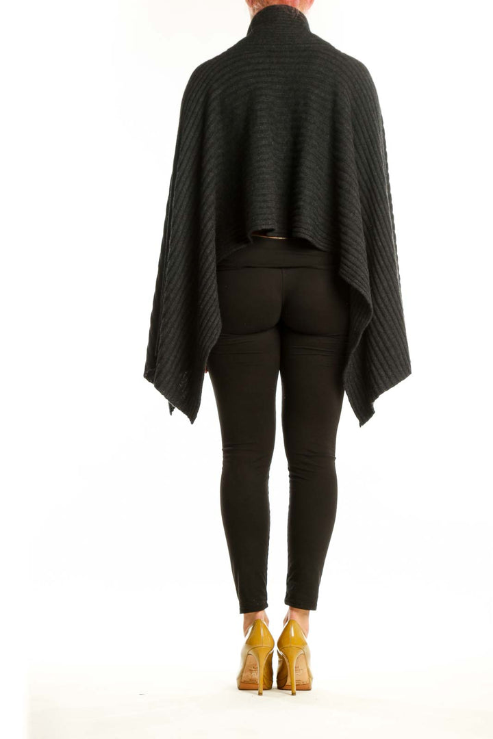 Black cashmere ribbed wrap poncho with asymmetrical hemline, back view with turtleneck detail