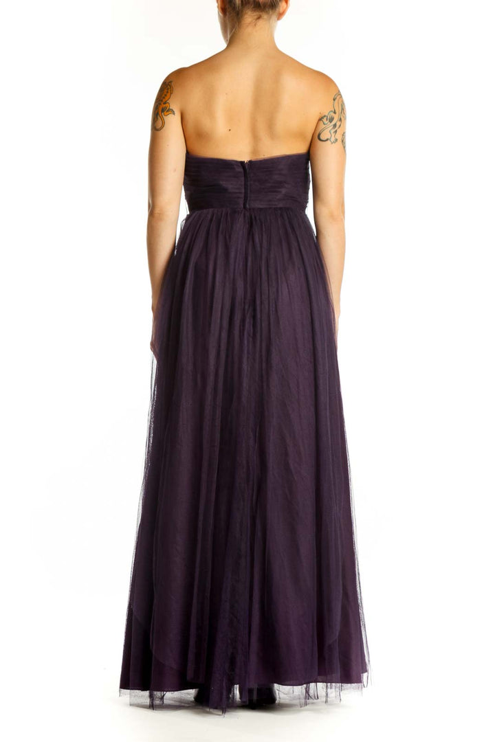 Navy sweetheart strapless tulle maxi dress with ruched bodice and flowing skirt, back view