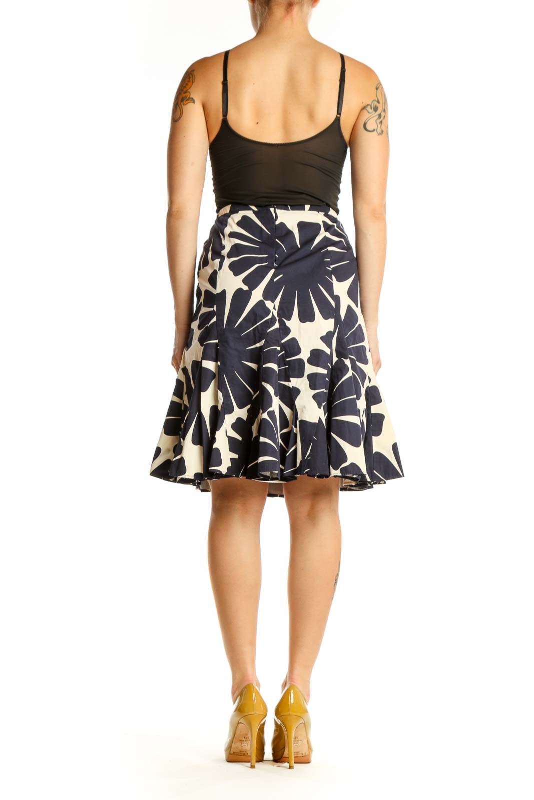 Navy and cream floral A-line skirt with geometric print, back view on model