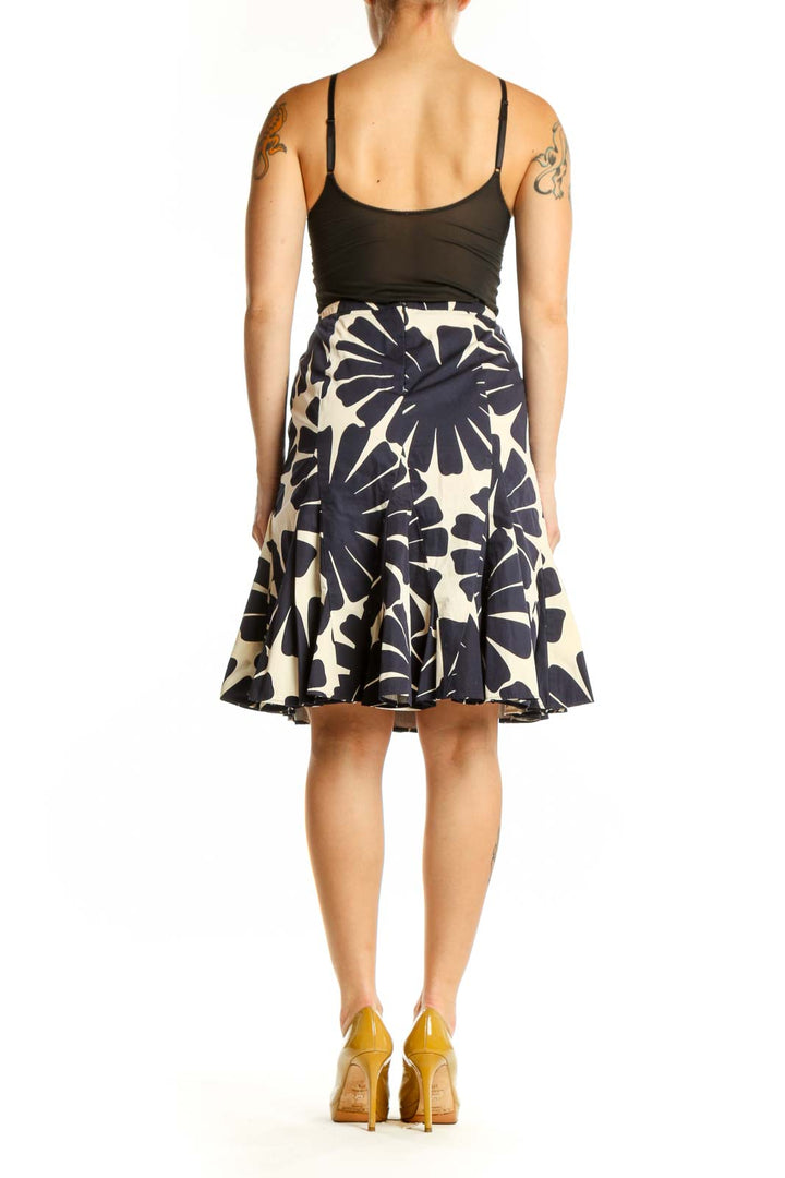 Navy and cream floral A-line skirt with geometric print, back view on model