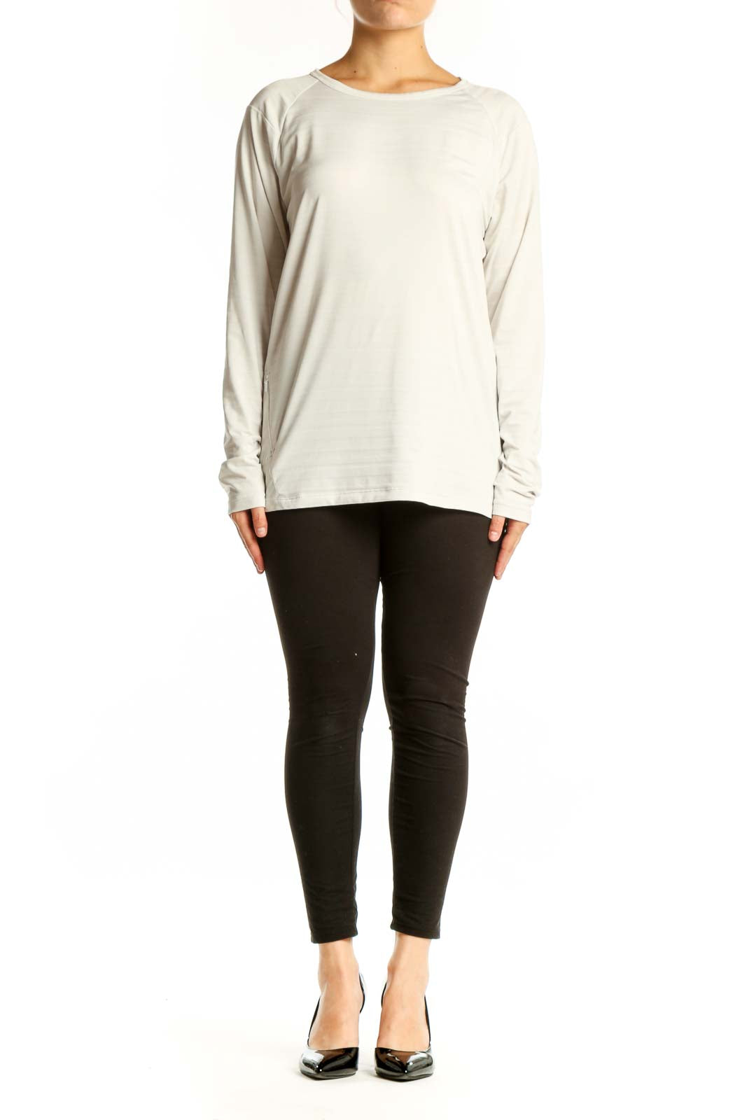 Cream long sleeve athletic top with crew neckline, front view on model