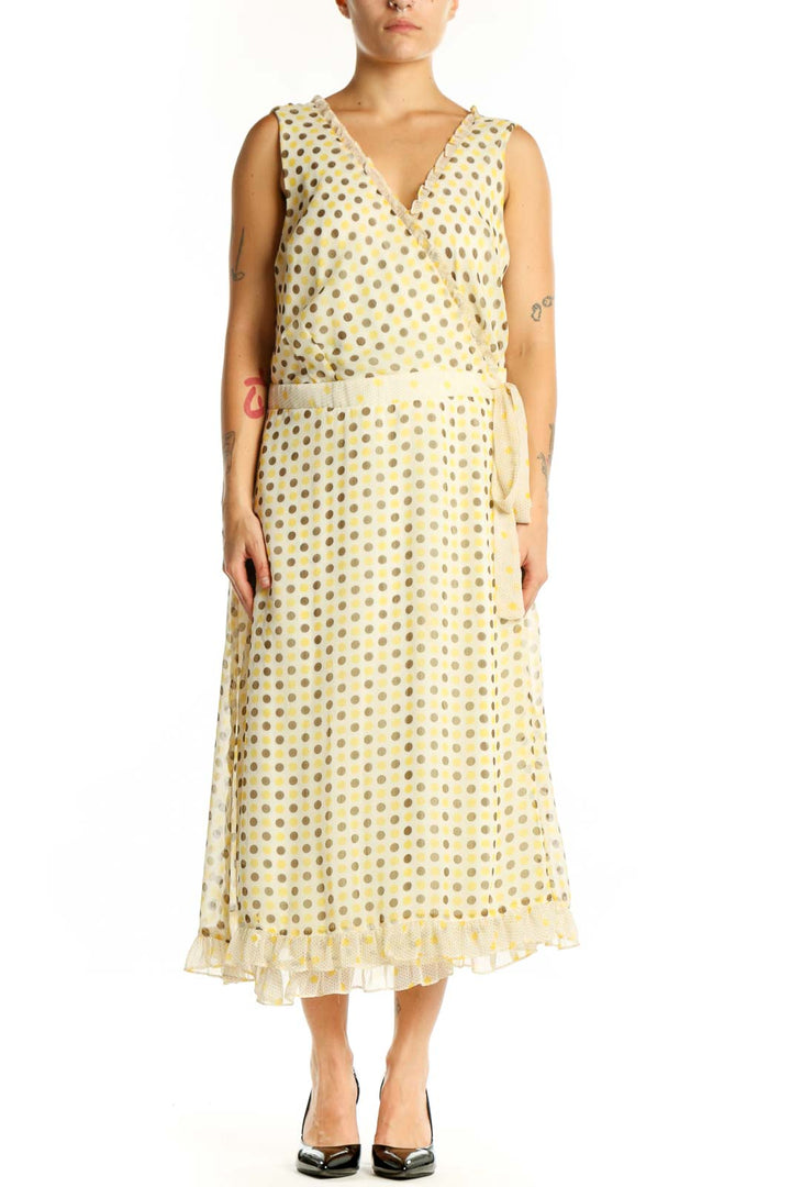 Front view of cream polka dot wrap midi dress with V-neckline and tie belt